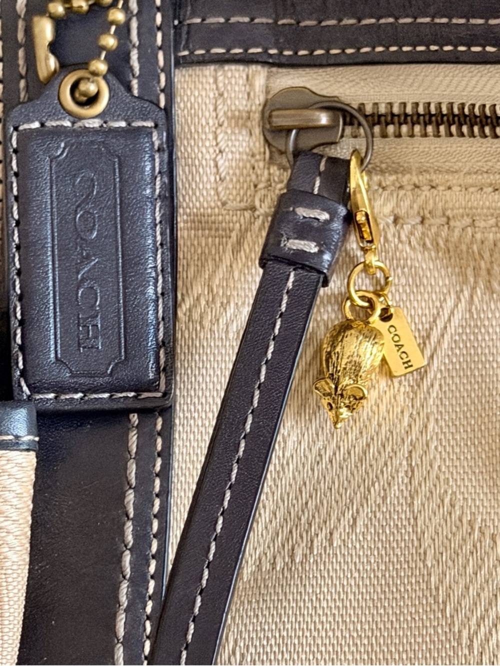 Mouse Bag Charm, featuring a textured metal finish and a signature brand tag.